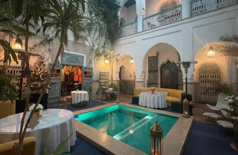 Luxury riad Marrakech courtyard Moroccan riad interior fountain Riad patio Marrakech lanterns